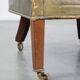 Green antique barrel back wingback chair on wheels
