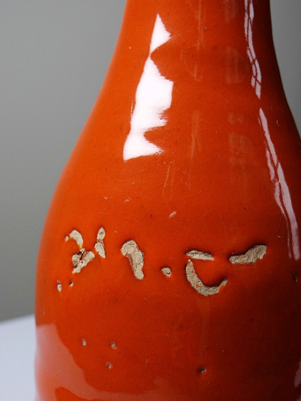 Bright orange mid-century decorative bottle lamp base glazed pottery.