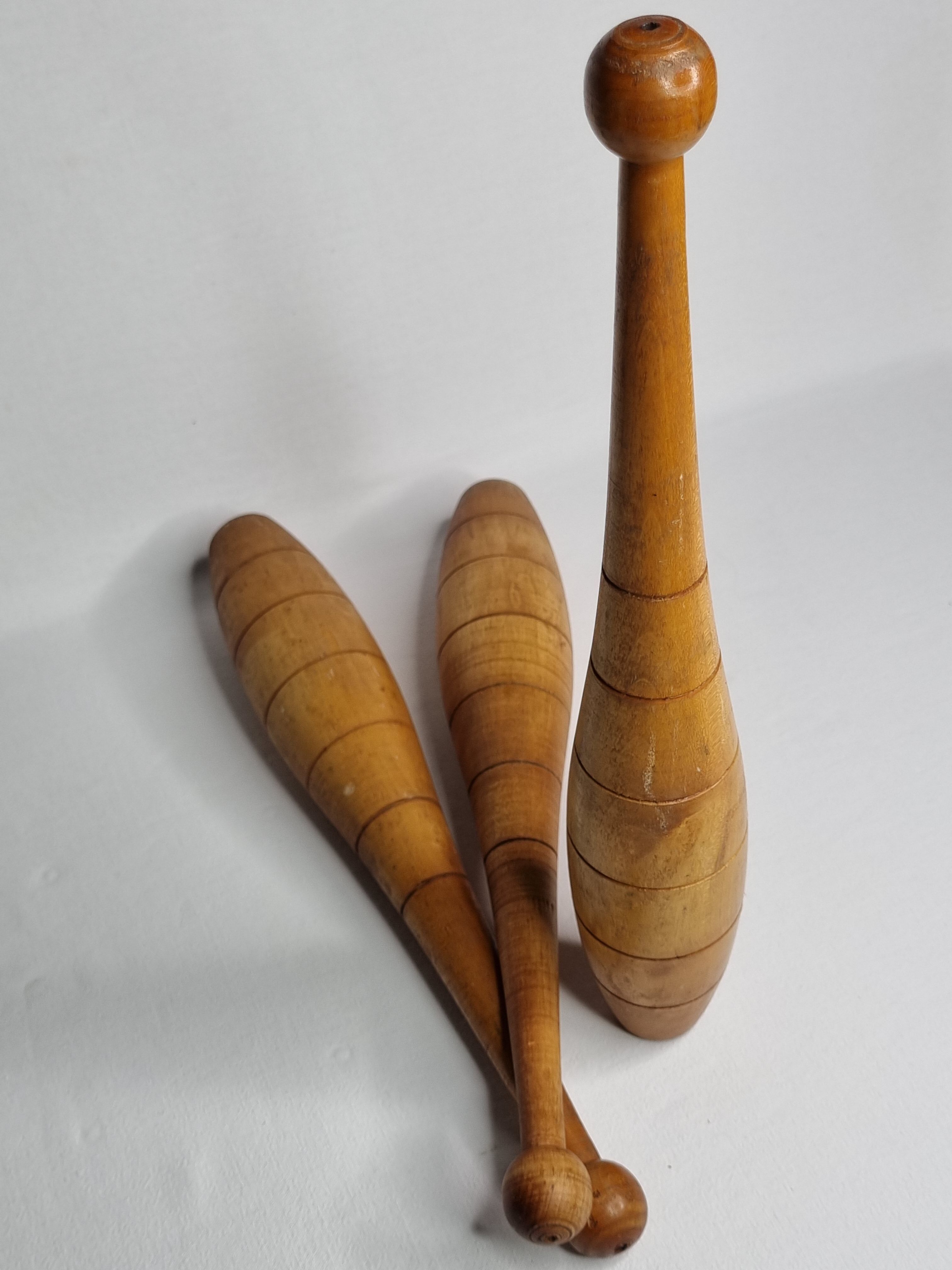 Set of three vintage juggling clubs in turned wood
