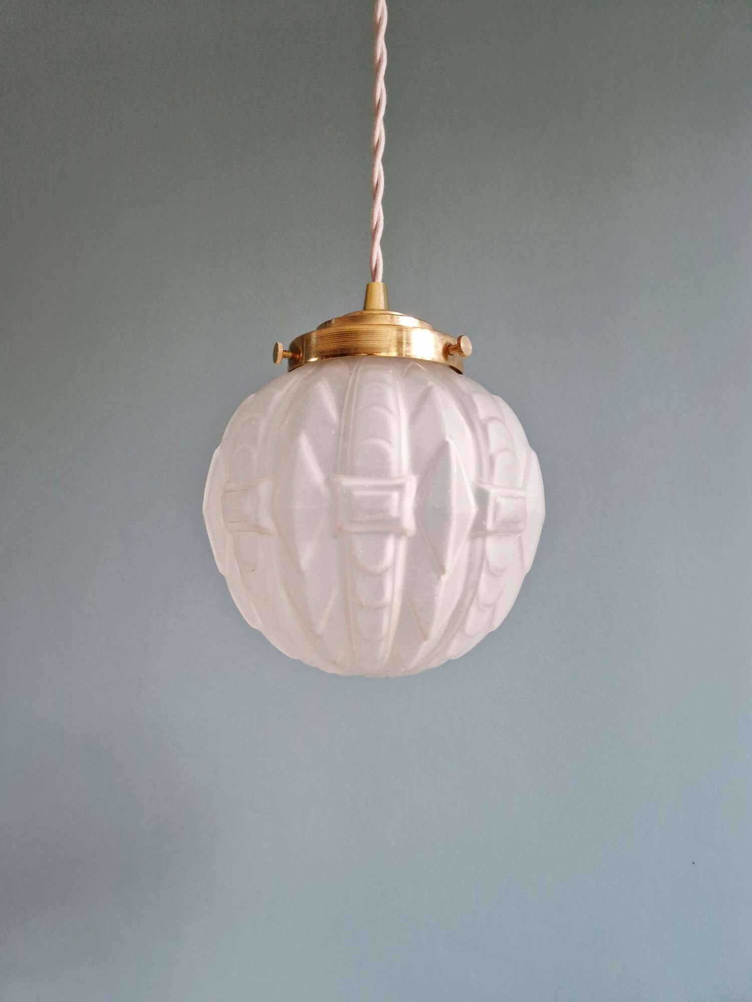 Pair of Art Deco pendant lights in pressed molded satin glass, 1920-30