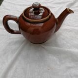 Brown ceramic teapot and milk jugs