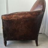 Club armchair in studded leather - early twentieth century