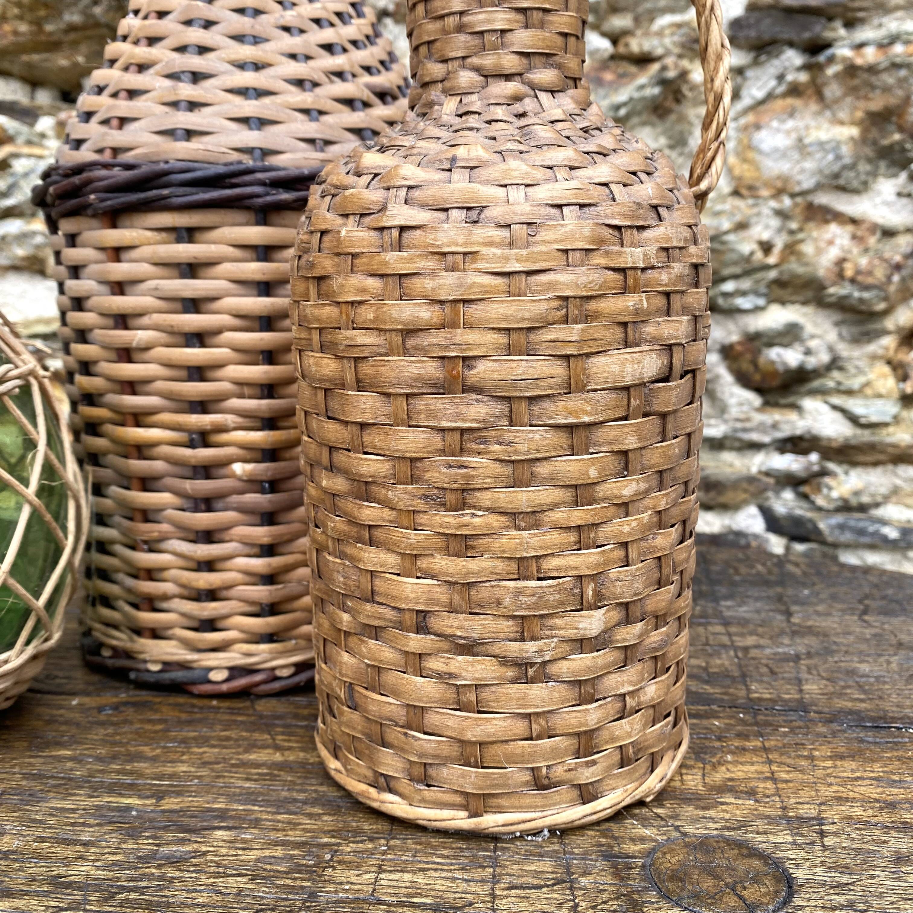 Glass bottles and rattan, woven wicker