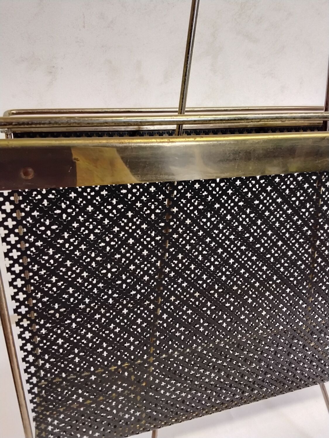 Vintage gold magazine rack from the 1960s.