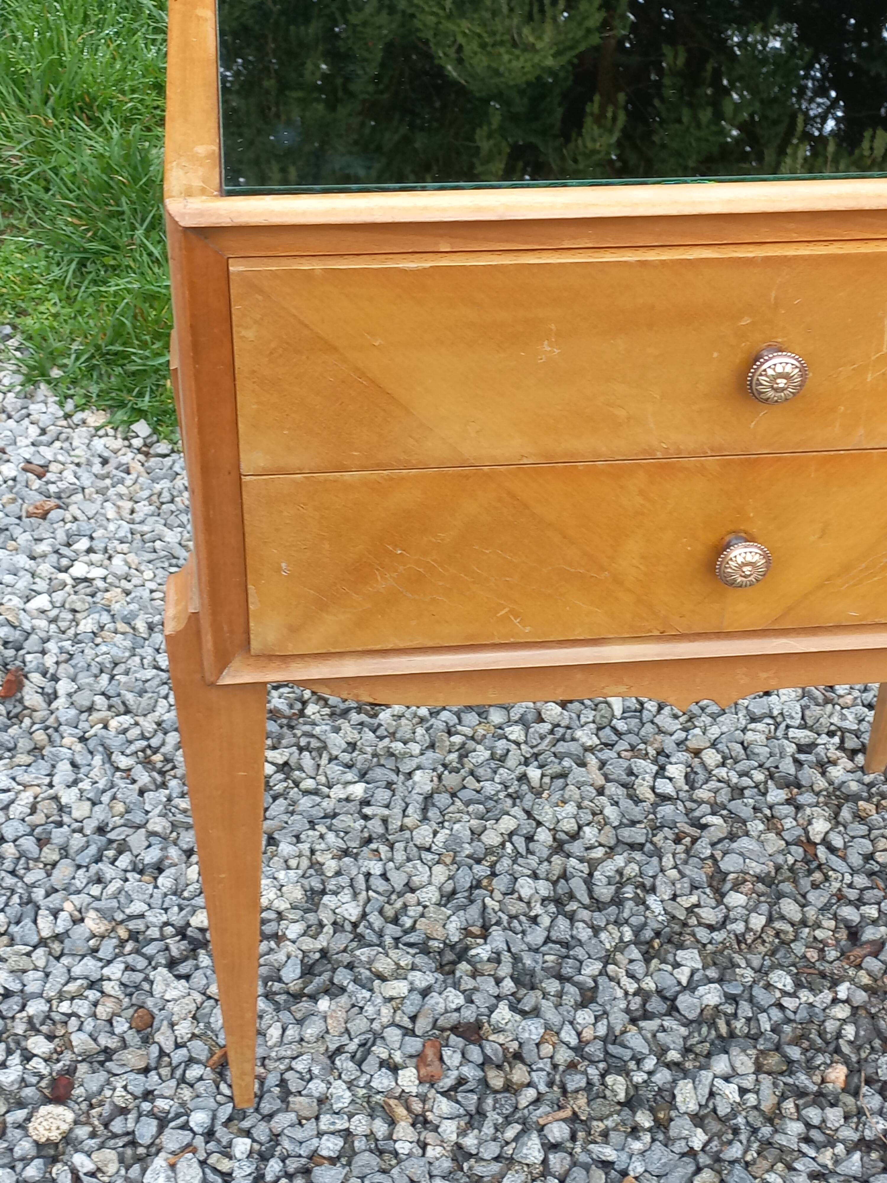 Vintage pair of bedside tables from the 1950s in sycamore and a mirror.