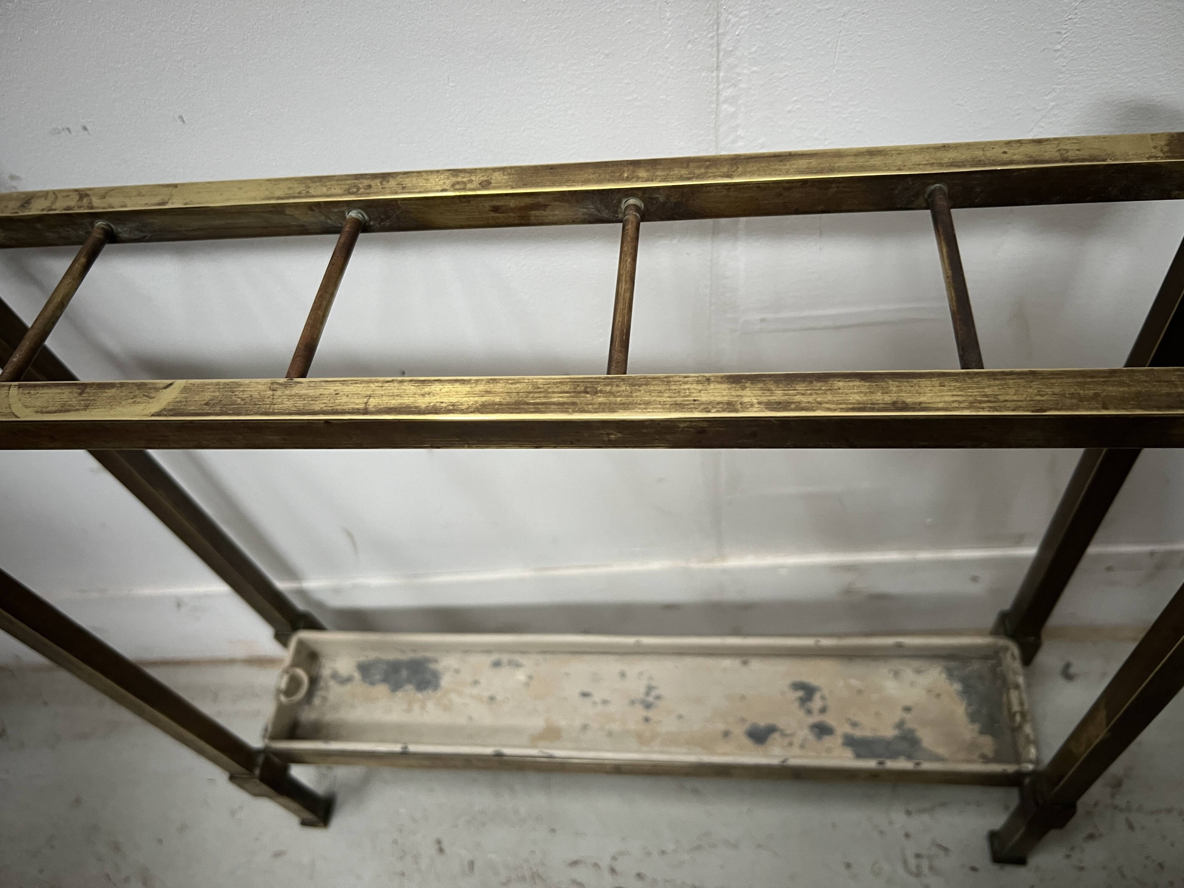 Brass and sheet metal umbrella stands from the 20th century.