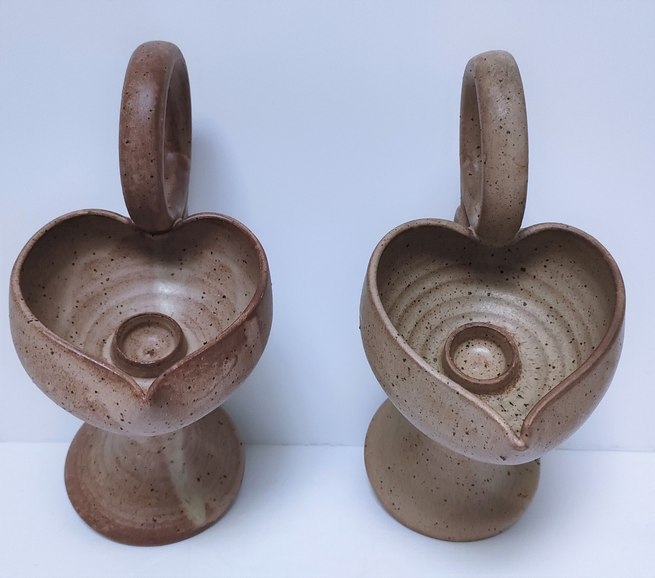 Pair of vintage “heart” sandstone candlesticks
