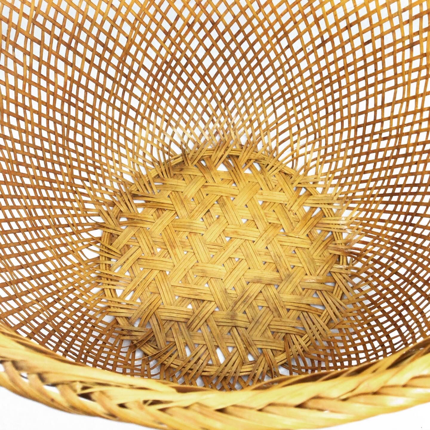 Openwork braided rattan basket