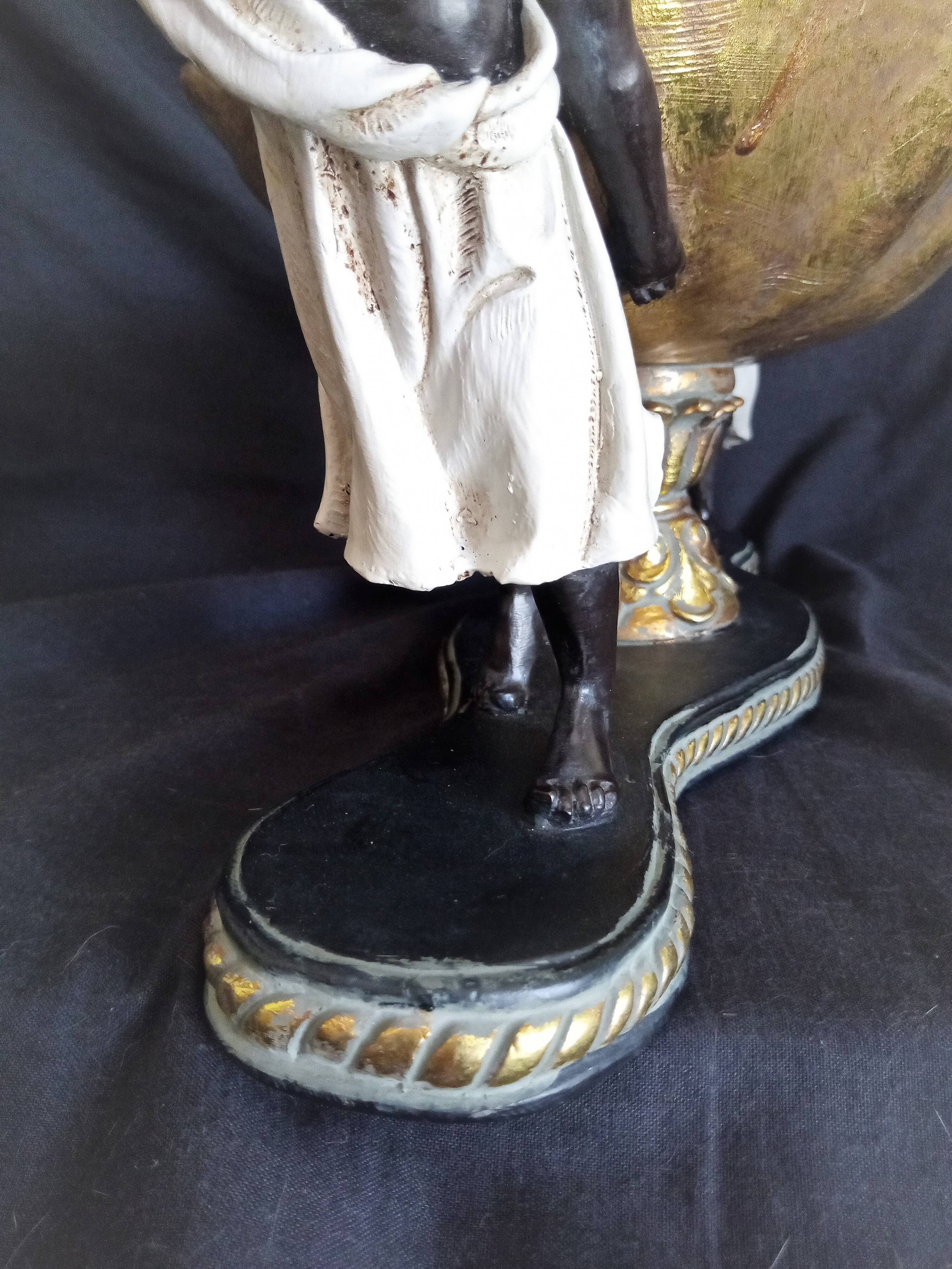 Centerpiece with African characters, plaster, resin and wood