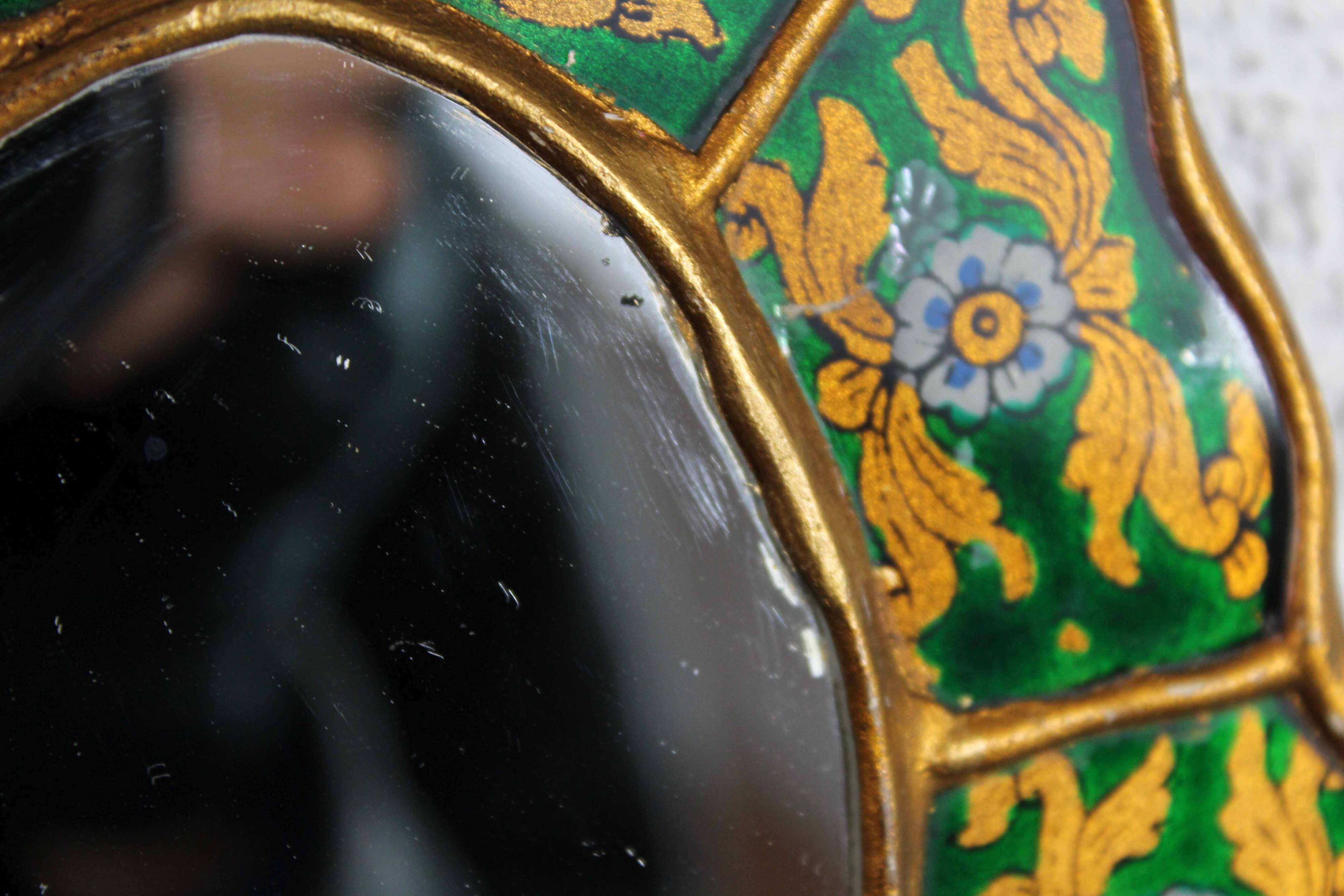 Golden mirror with decor