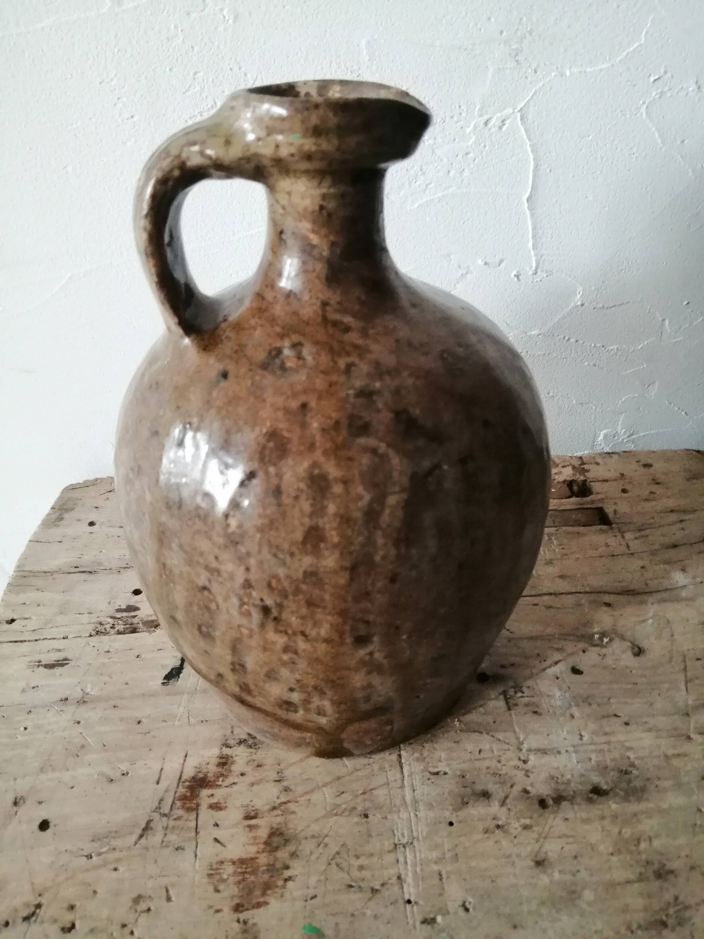 Small very old glazed jug
