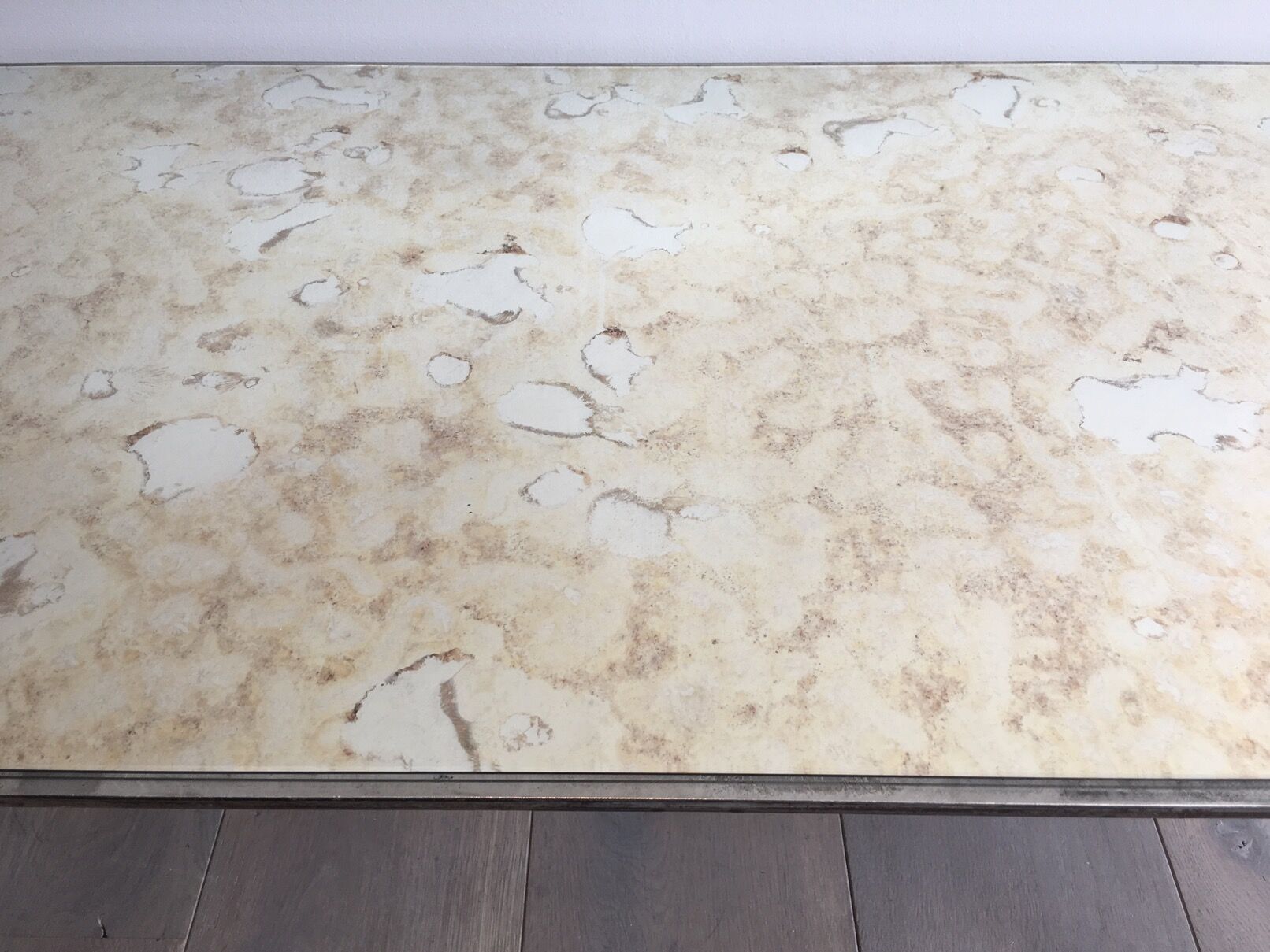 Coffee table in brushed steel and brass