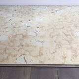 Coffee table in brushed steel and brass