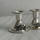 Pair of vintage metal candlesticks with a grape pattern.