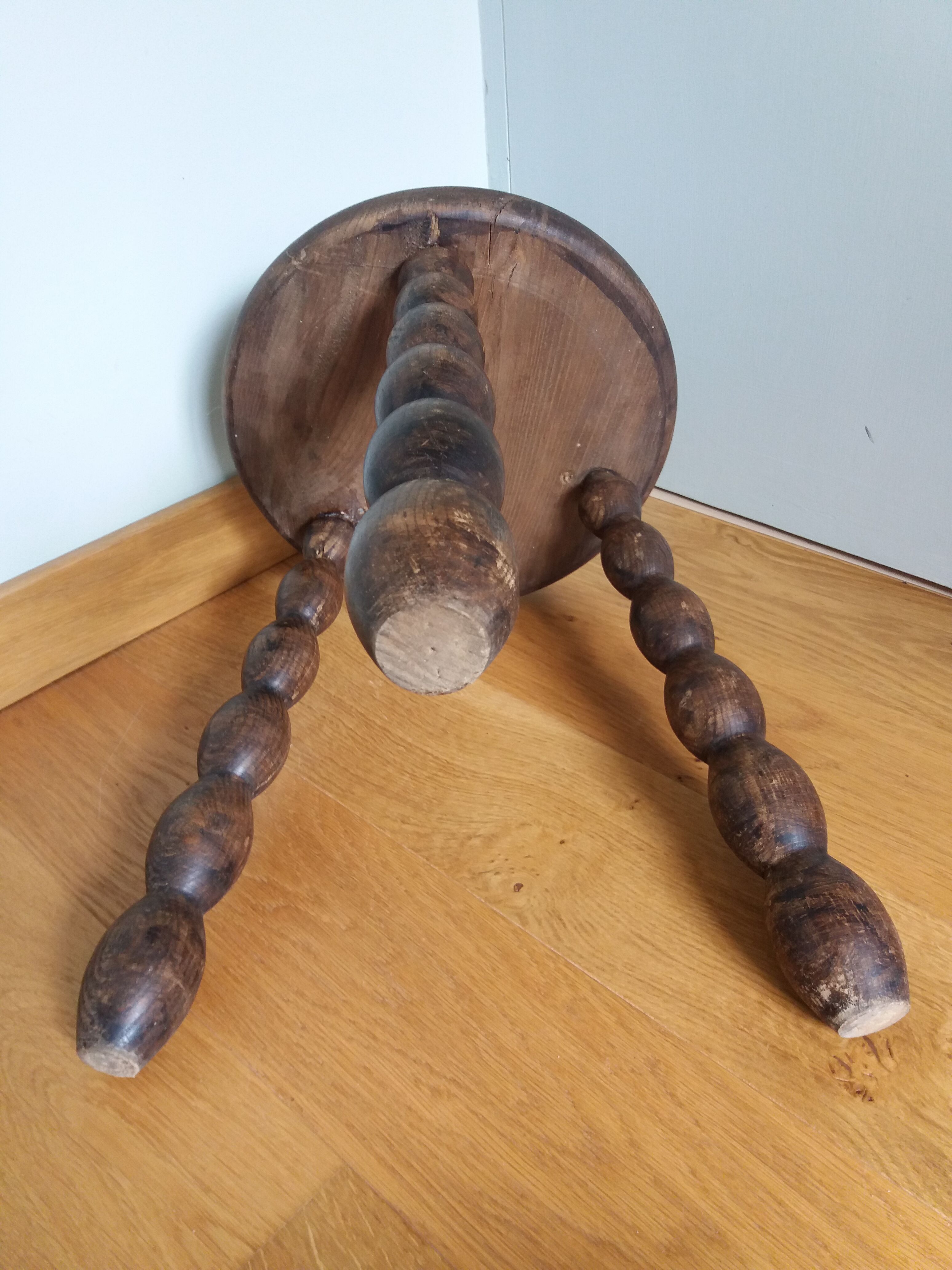 Tripod stool in wood turned coil way