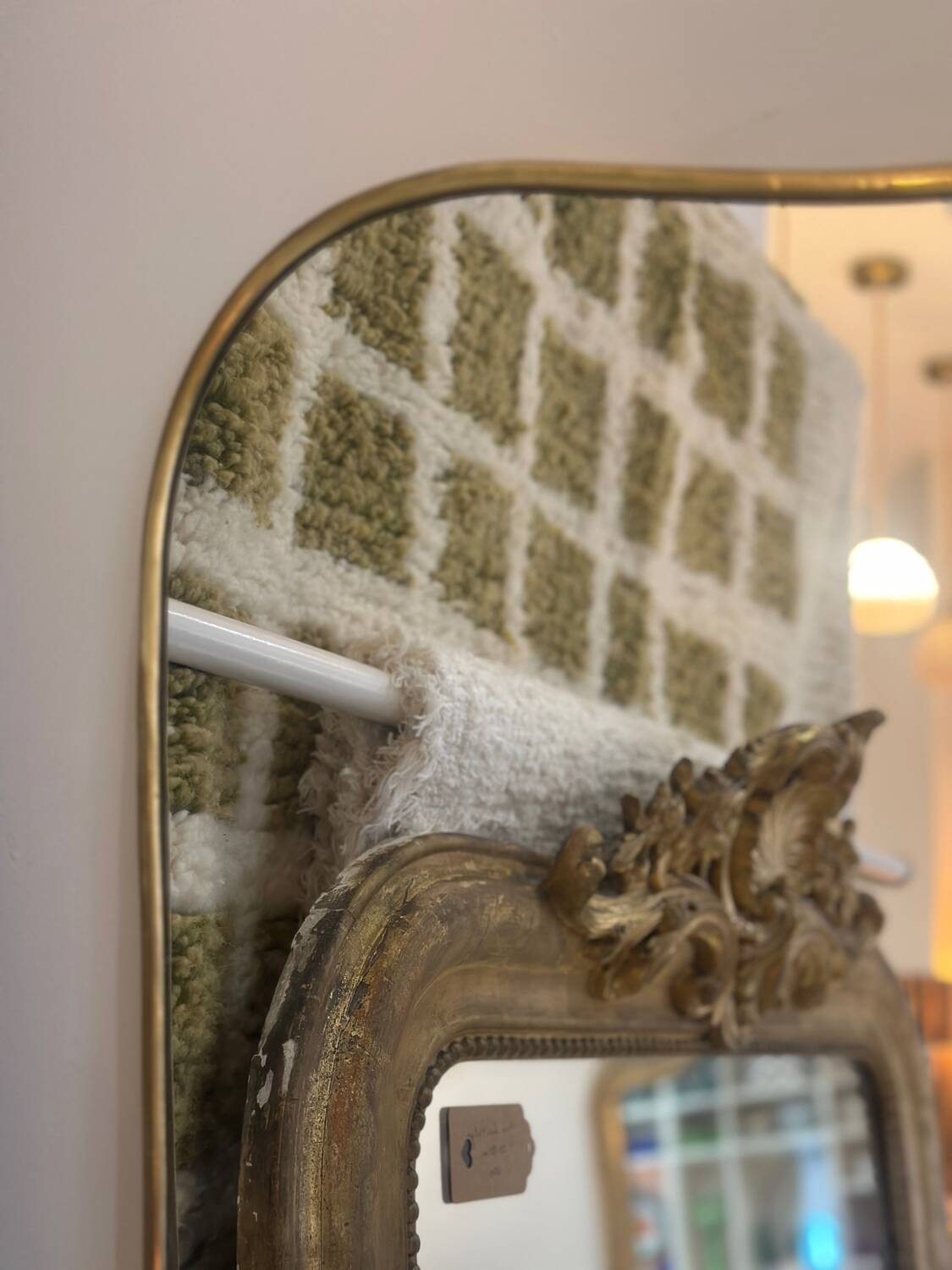 Long trapezoidal mirror in curved gilded brass, art deco modernist