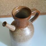 Vintage kid jug in two-tone sandstone with a handle and spout