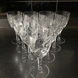 Crystal cut water stemmed glasses. Star and leaf patterns.