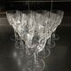 Crystal cut water stemmed glasses. Star and leaf patterns.