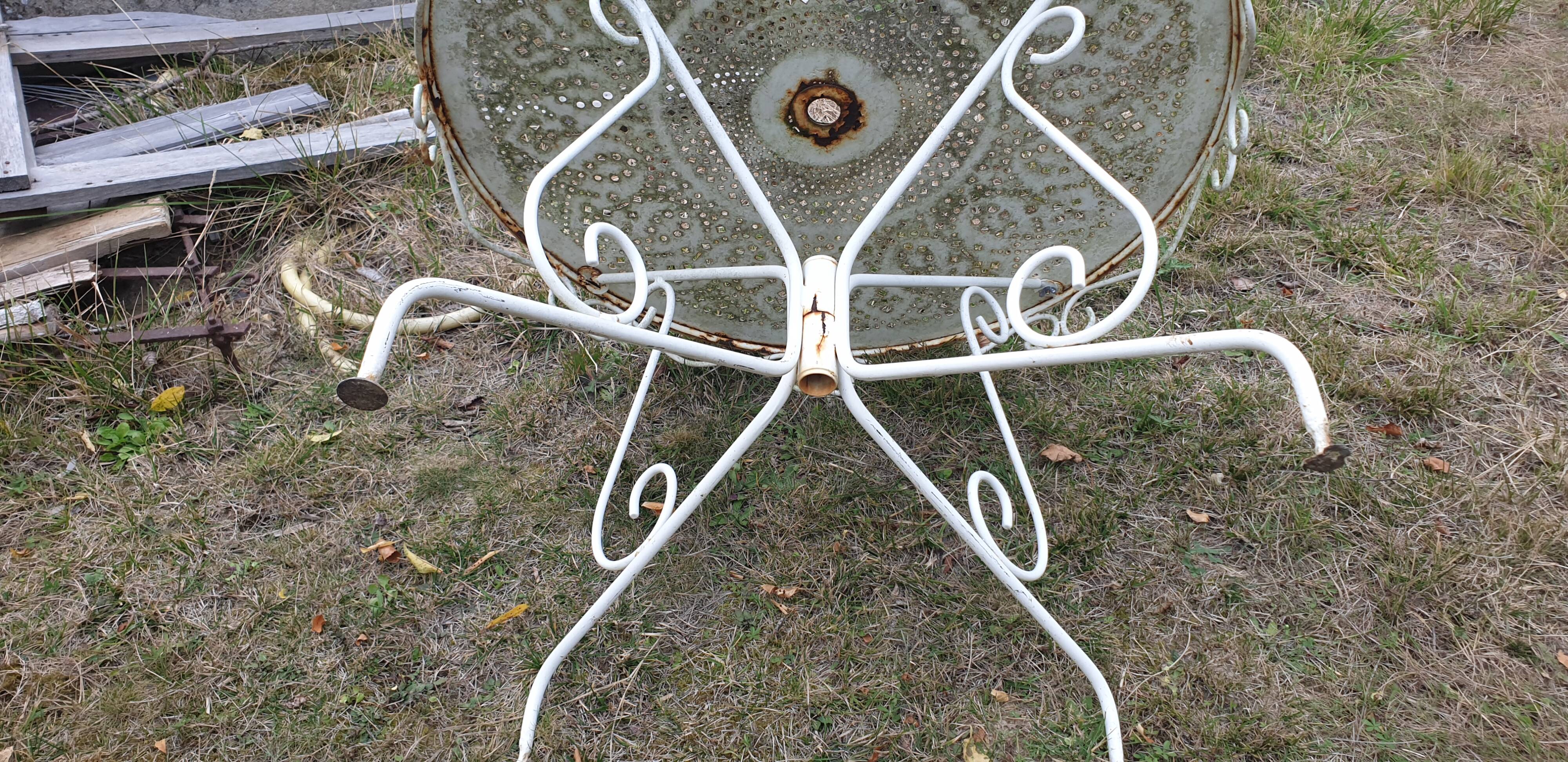 Ornate wrought iron garden table