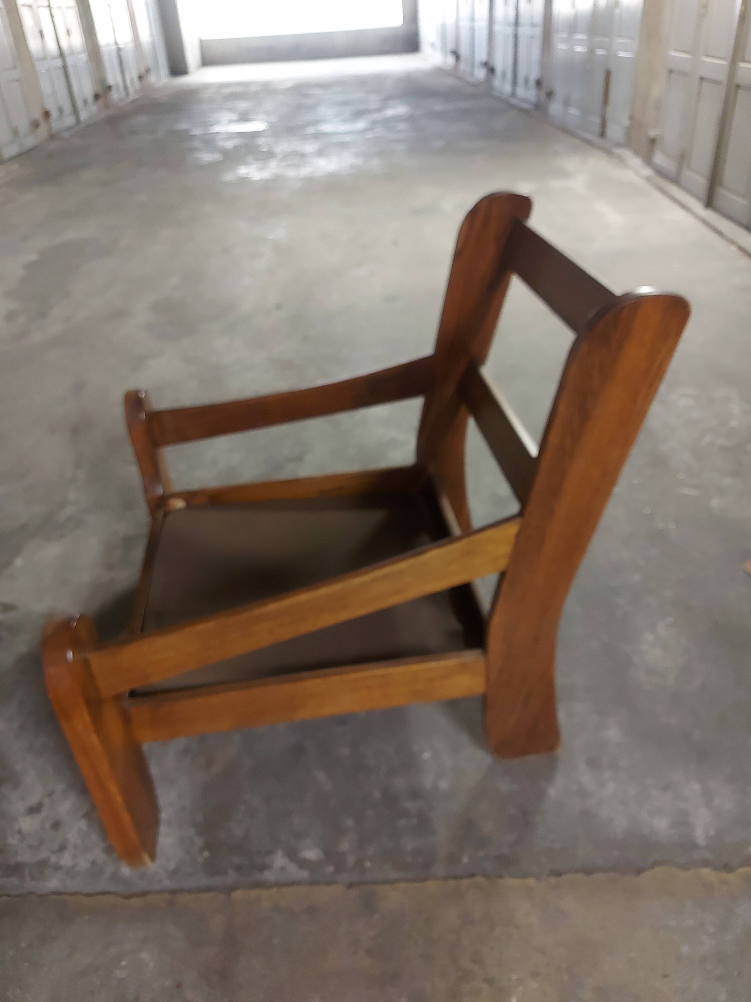 Armchairs in leather and vintage wood 70's