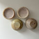 2 small stone urns