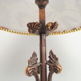 Rock-style table lamp with its vintage bird pattern shade