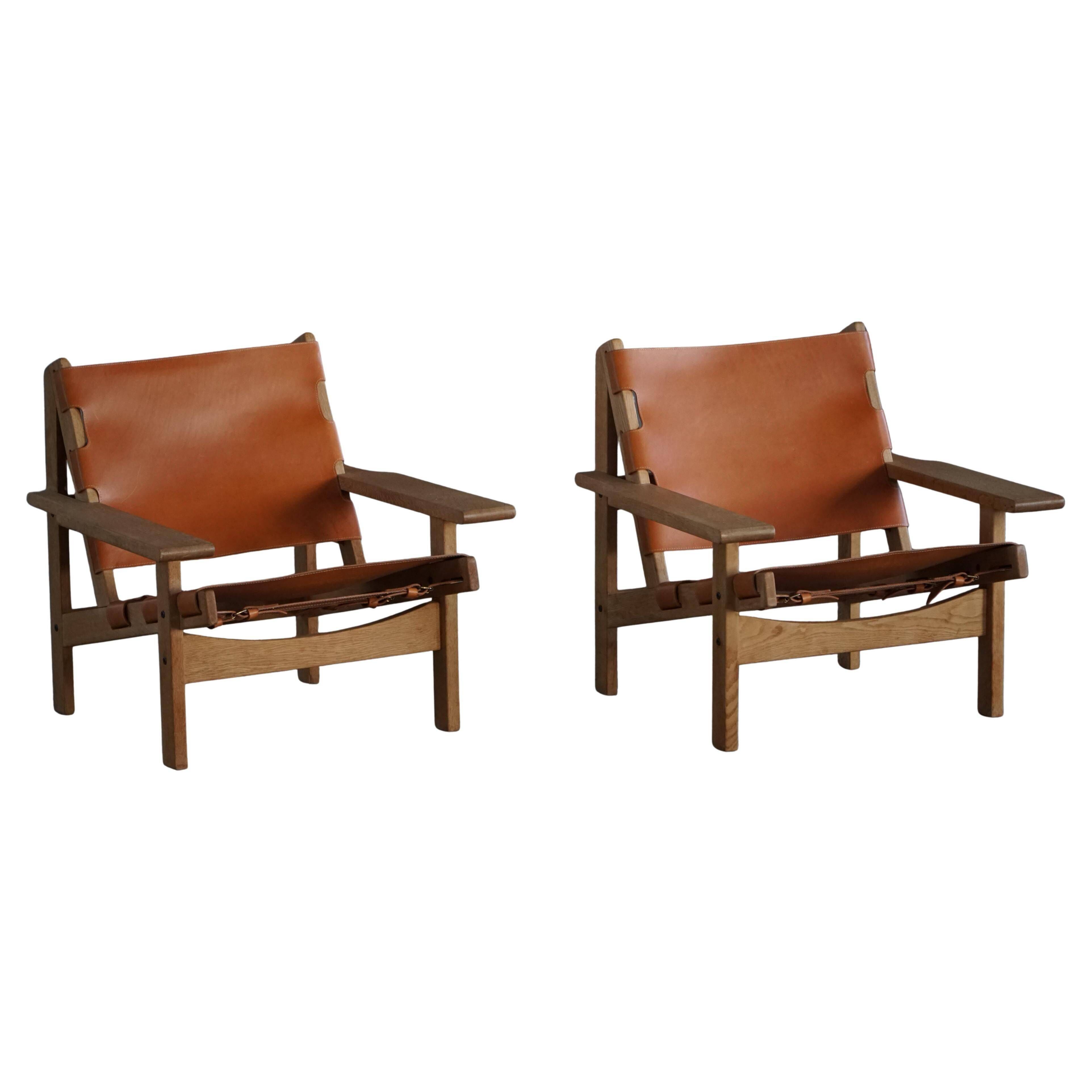 Pair of hunting chairs in oak and leather by Kurt Østervig, Danish modern, 1960s.