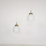 Set of two milk glass and brass design lights