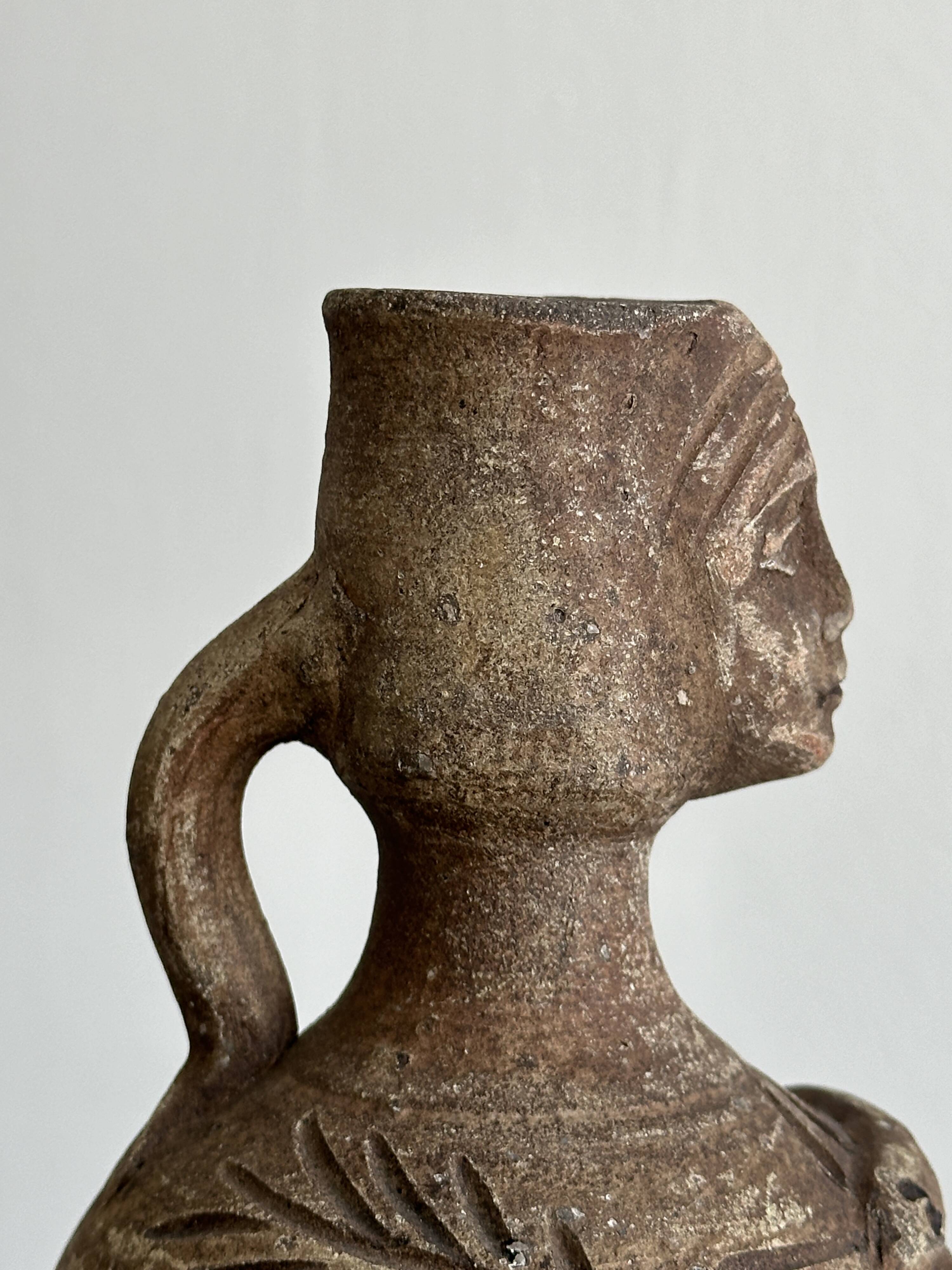 Decorative vase in raw terracotta