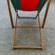 Vintage folding wooden deck chair with red and green striped canvas from the 1970s.