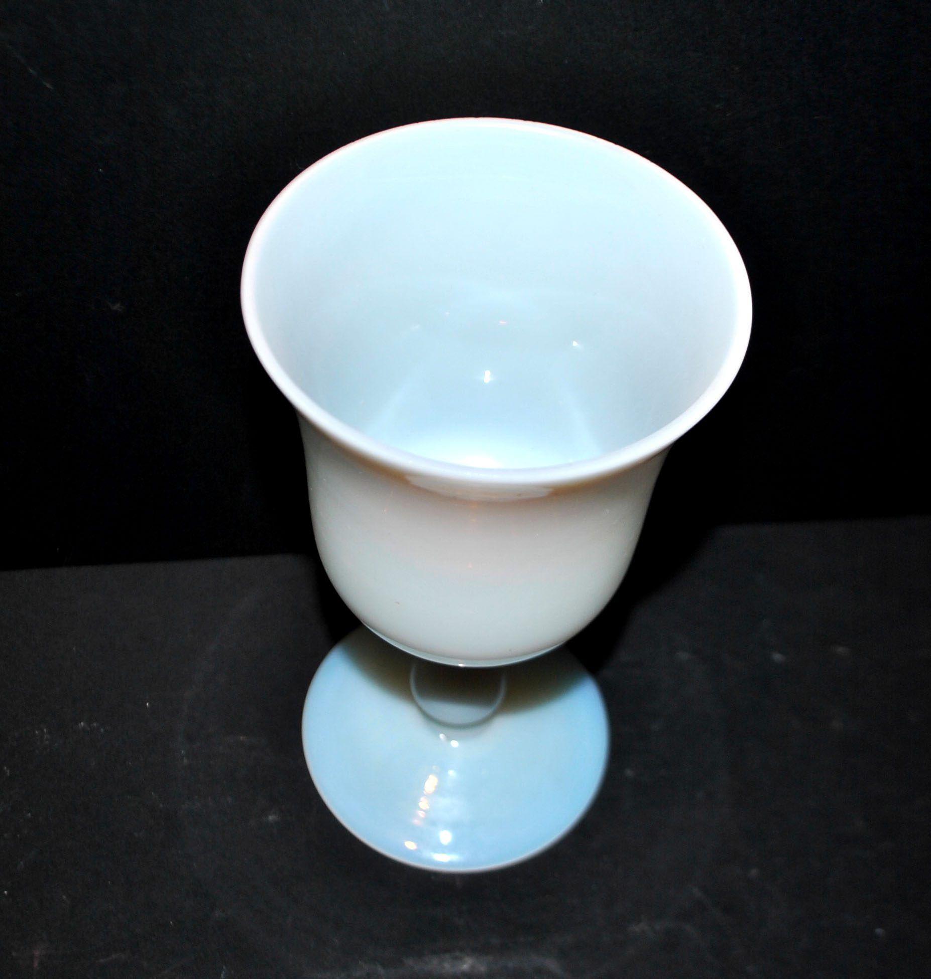 Ancient opaline white glass goblet with a soap bubble effect.