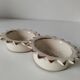 Duo of handmade beige and terracotta earthenware empty pockets
