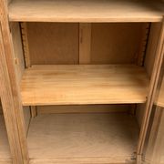Asymmetrical Art Deco glass-fronted Parisian wardrobe in raw oak, 1930.
