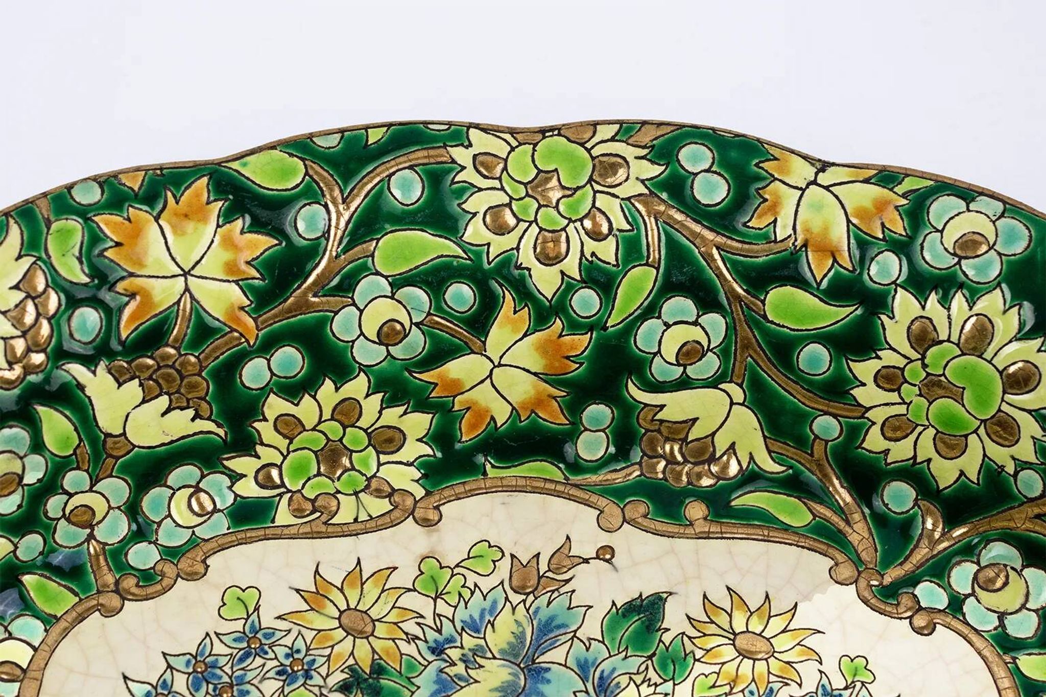 Longwy cup in cloisonné enamels on a green background, polychrome floral decoration and gold