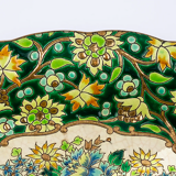 Longwy cup in cloisonné enamels on a green background, polychrome floral decoration and gold