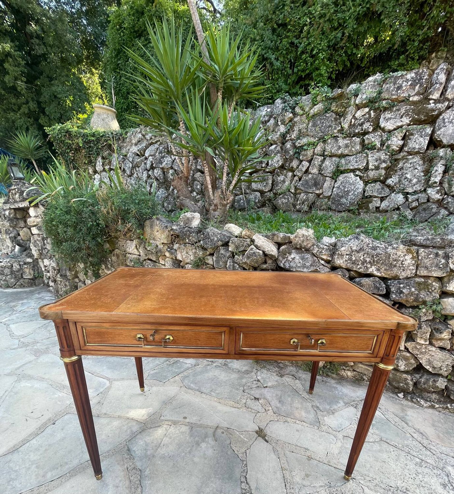 Louis XVI style mahogany flat desk from the late 19th century