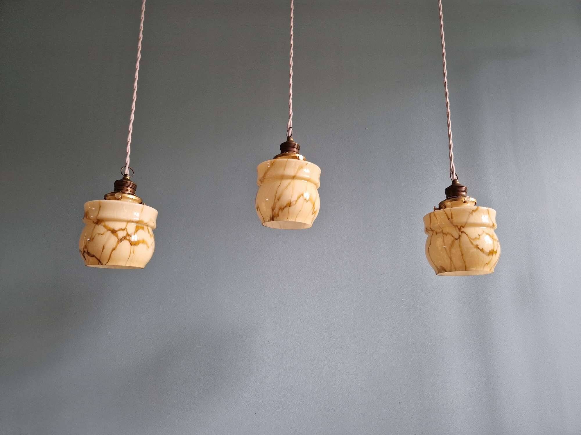 Art Deco trio of suspensions in opaline and marbled ouraline, Scailmont, 1920-30.