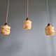 Art Deco trio of suspensions in opaline and marbled ouraline, Scailmont, 1920-30.