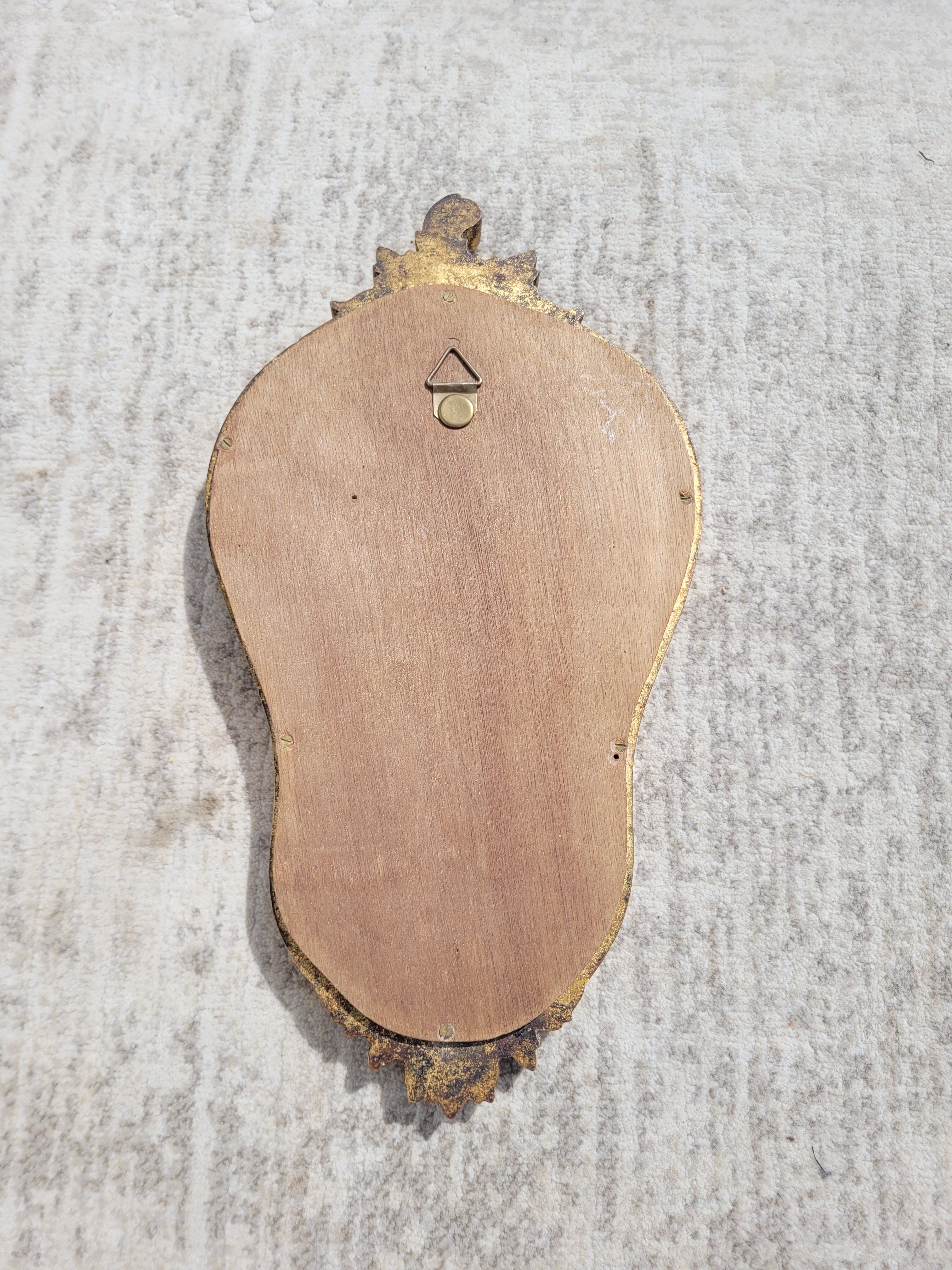 Small gilded mirror with pediment 1960