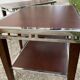 Pair of modernist chrome, leather and wood side tables.