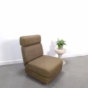 Vintage pull-out sofa bed, brown checked lounge chair with chrome.