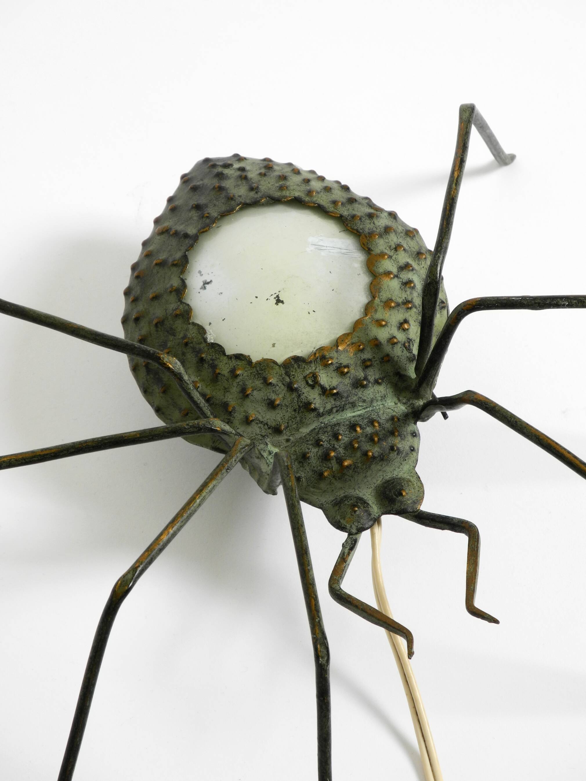Beautiful Italian Mid Century Modern "Spider" wall lamp made of metal