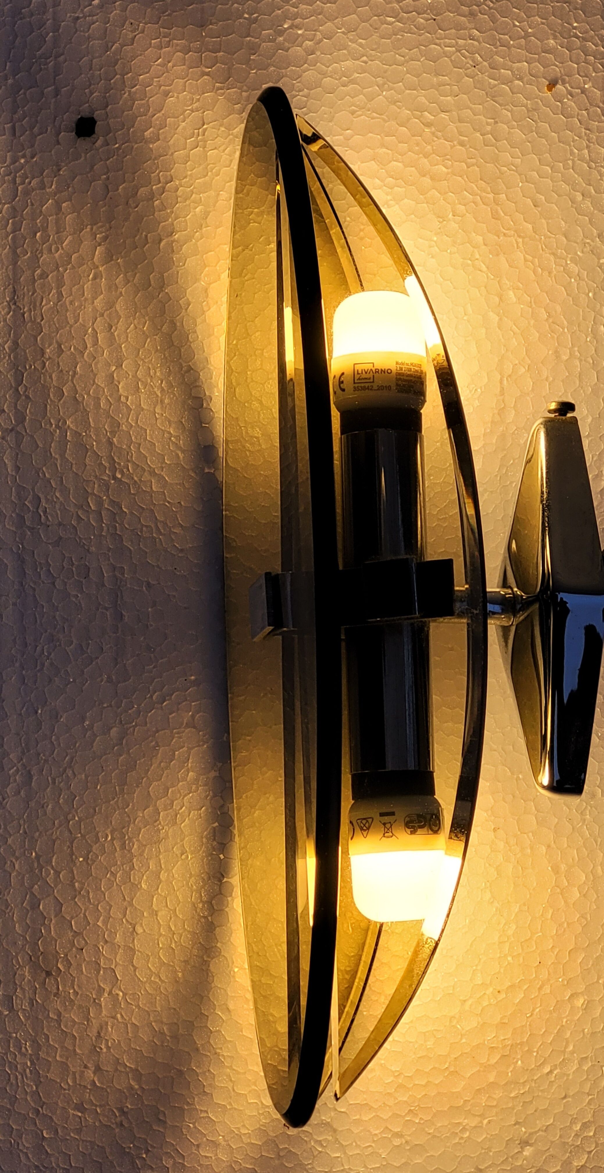 Pair of elliptical italian wall lamps in smoked glass and chrome veca