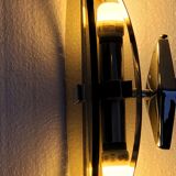 Pair of elliptical italian wall lamps in smoked glass and chrome veca