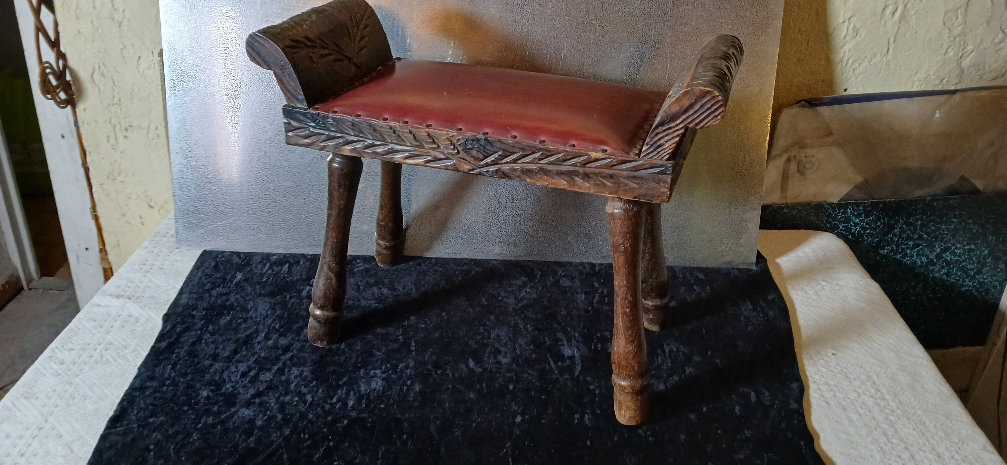 Carved wood and faux leather bench or vintage spanish ottoman footstool
