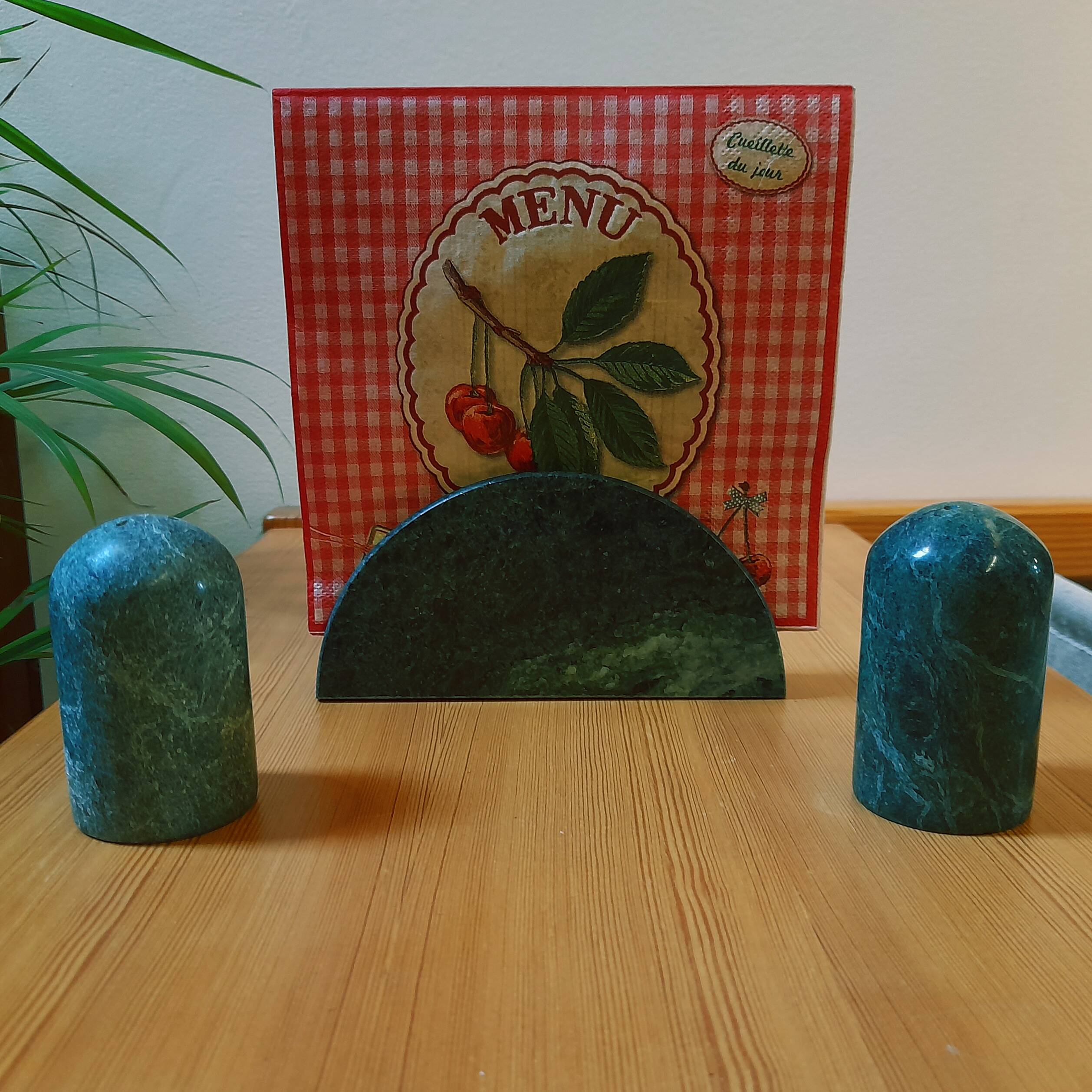 Trio of salt shakers, pepper shakers and napkin holders in green marble