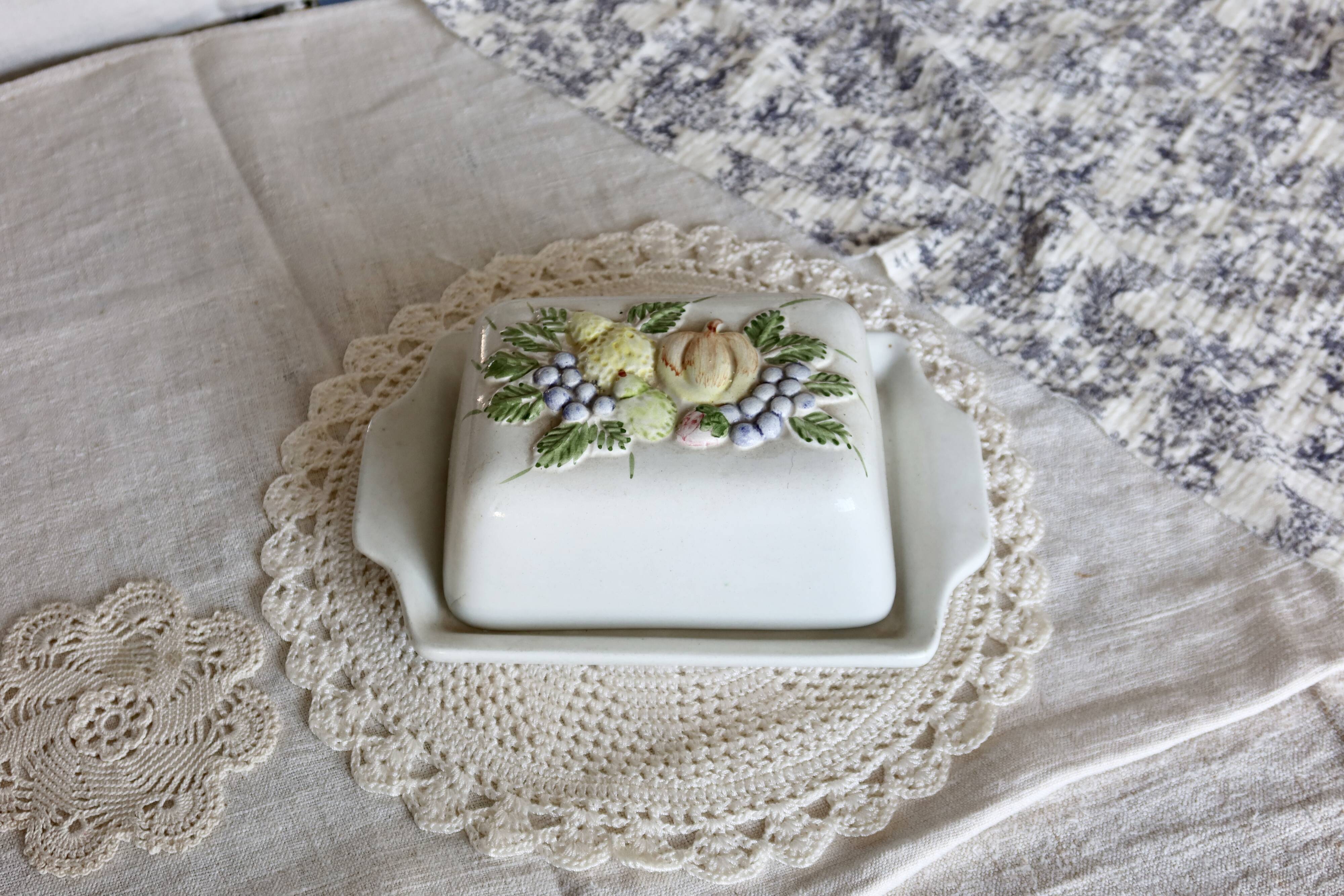 Large vintage earthenware and slip butter dish with fruit motif