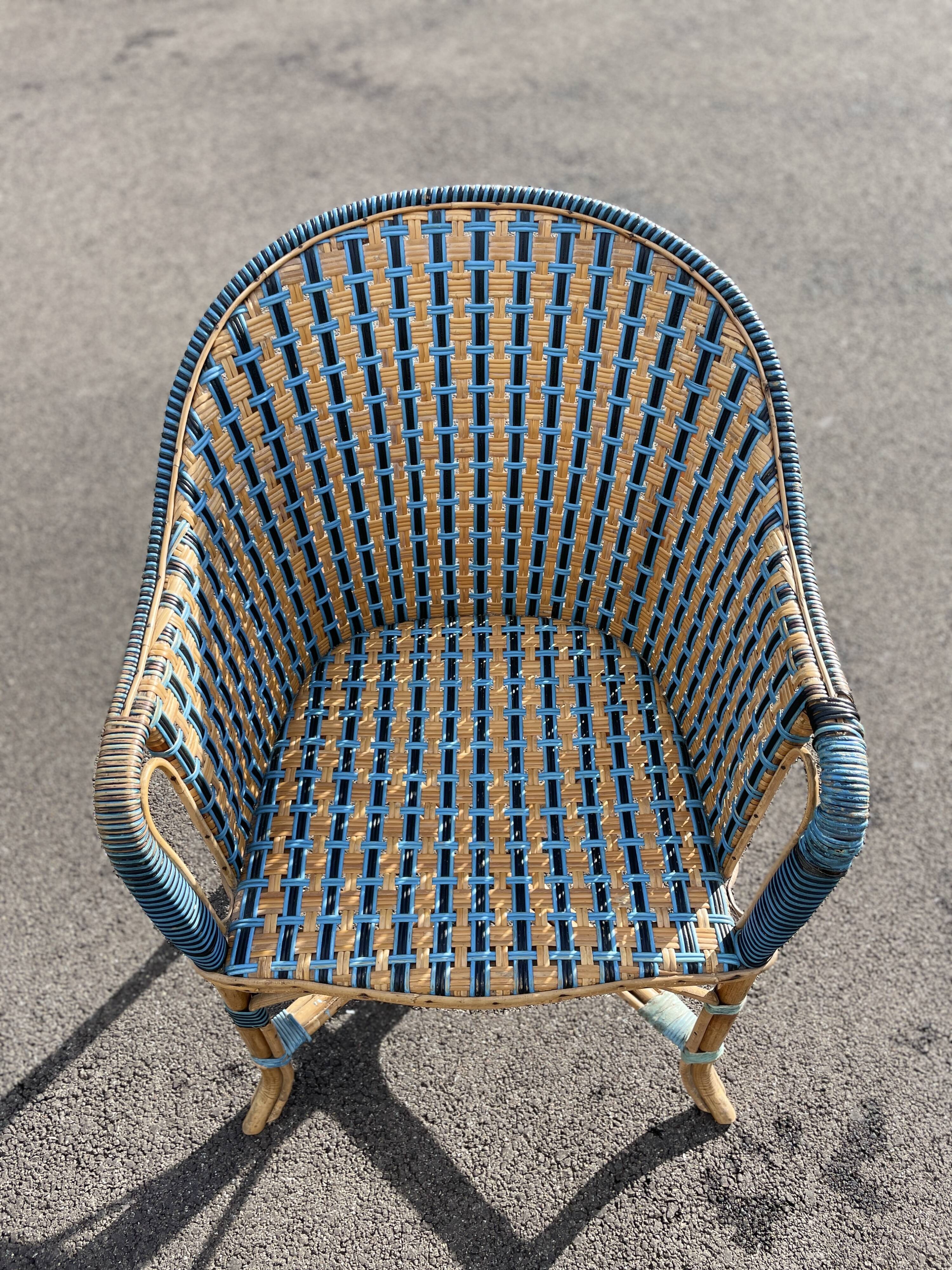 Old vintage woven and rattan wicker armchair 1930