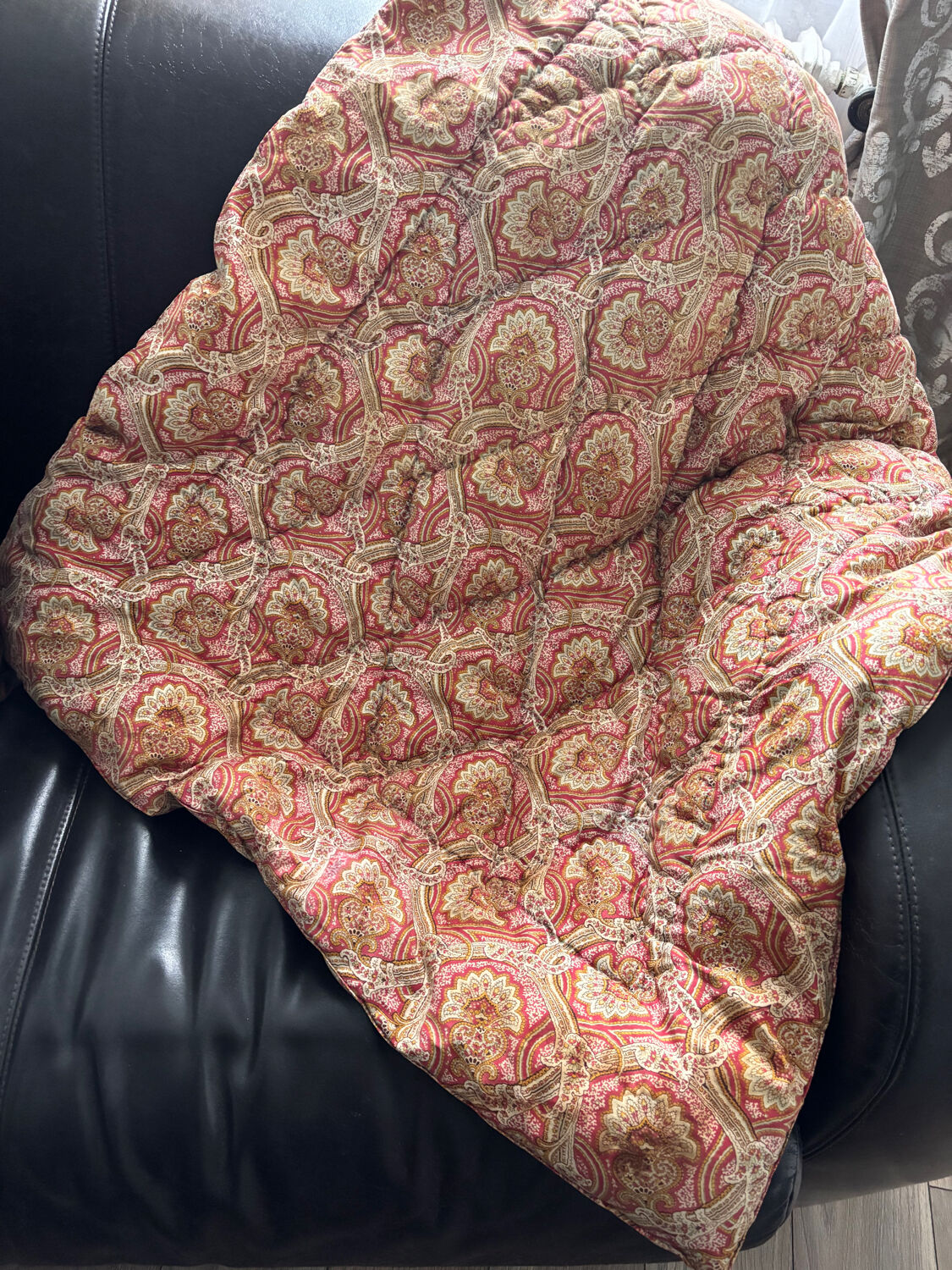 Vintage duvet/bedspread with a paisley pattern.